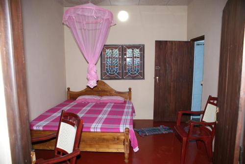 Postel nebo postele na pokoji v ubytování Kalpitiya Guest House