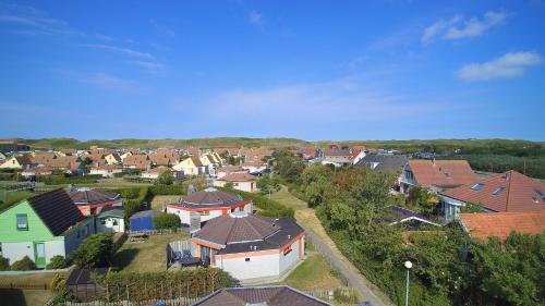 an aerial view of a small town with houses at Ferienhaus am Meer mit Kamin & Sauna - Seestern 251 in Julianadorp