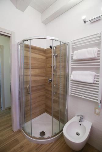 a bathroom with a shower and a toilet and a sink at Venice Loft in Marghera