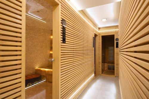 
a bathroom with a mirror and a walk in shower at Garni Hotel Ema in Kragujevac
