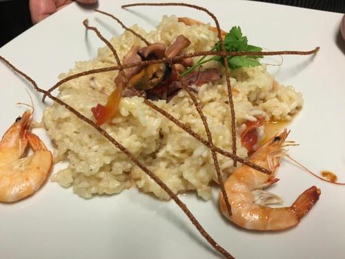 a plate of food with shrimp and rice at Casale Antonietta in Sorrento
