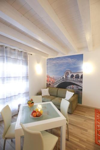 a living room with a table and a couch at Venice Loft in Marghera