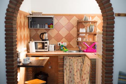 Kuchyň nebo kuchyňský kout v ubytování Hospedaje Lisboa Algeciras
