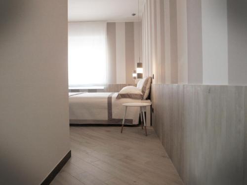 En eller flere senge i et værelse på Settimo Piano