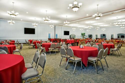 a conference room with red tables and chairs at La Copa Inn Beach Hotel in South Padre Island