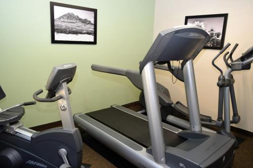 a gym with two tread machines on a treadmill at Baymont by Wyndham Pierre in Pierre