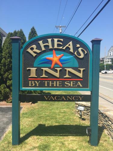 a sign for a sign for a sea aquarium at Rhea's Inn by the Sea in Middletown