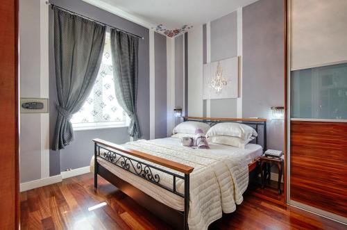 a bedroom with a bed and a window at House DelMarco in Split