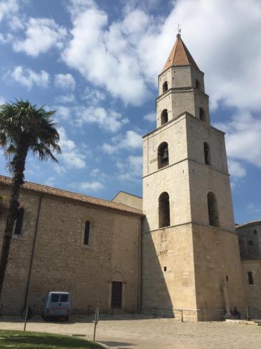 a building with a tower on the side of it at Ca' del Borgo in Venosa