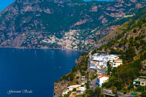 a view of positano on the amalfi coast at Albadamare Boutique Hotel in Praiano