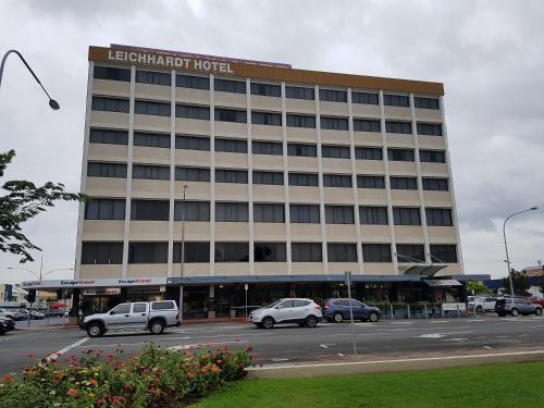 a large building with cars parked in front of it at Leichhardt Hotel in Rockhampton