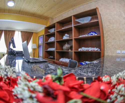 an office with a desk with a laptop on it at Sapphire Addis in Addis Ababa