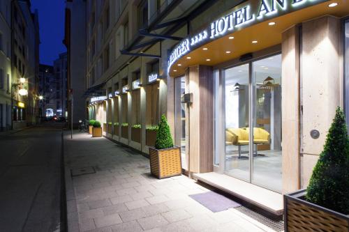 a store front of a building with a sign on it at Hotel an der Oper in Munich