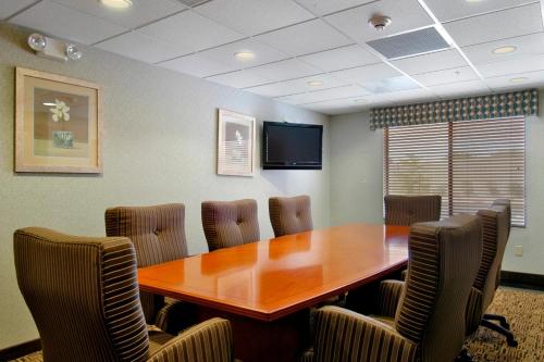 a conference room with a wooden table and chairs at Wingate by Wyndham Yuma in Yuma