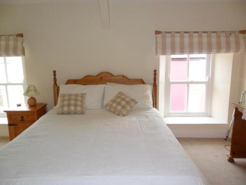 Katil atau katil-katil dalam bilik di Croi an Bháile Luxury Apartment