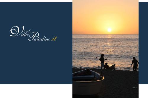 a group of people fishing on the beach at sunset at Villa Paladino - B&B e Guest House in Scilla