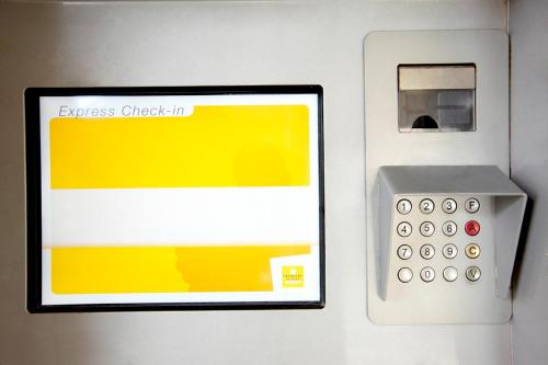 annexcheckin machine on the side of a wall at Premiere Classe Dunkerque Est Armbouts Cappel in Armbouts-Cappel