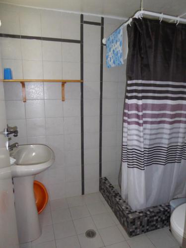 a bathroom with a shower and a sink at Halki Townhouse in Halki