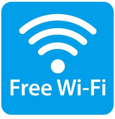 a free wifi logo on a blue screen at Hotel Los Inn Kochi in Kochi