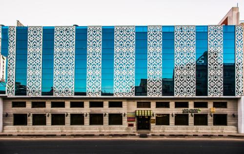 a building with blue and white tiles on it at Leisure Inn Grand Chanakya in Jaipur