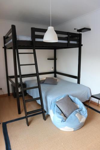 a bedroom with a bunk bed with a pillow on the floor at Casa da Planicie in Évora