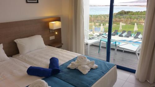 Giường trong phòng chung tại Marica's Boutique Hotel