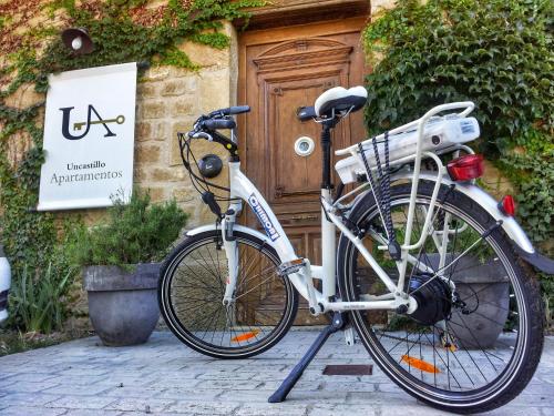 a bike is parked in front of a door at Apartamentos Uncastillo in Uncastillo