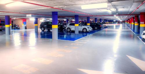 a large parking garage with cars parked in it at Occidental Murcia Agalia in Murcia