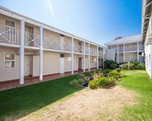 anteriorterior view of a building with a yard at Vetho 2 Apartments OR Tambo Airport in Kempton Park