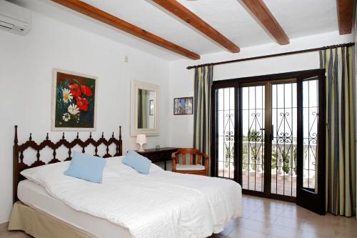 Ένα ή περισσότερα κρεβάτια σε δωμάτιο στο Can Carlos Ibiza