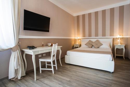 Ένα ή περισσότερα κρεβάτια σε δωμάτιο στο Les Suites Magnolia