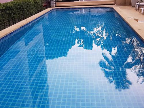 a pool with a map of the world on it at Flame Tree Suite 110 sqm 2-Bedroom Apartment in Hua Hin