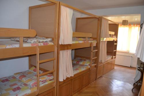 a room with four bunk beds in a room at Hostel Valentin 2 in Skopje