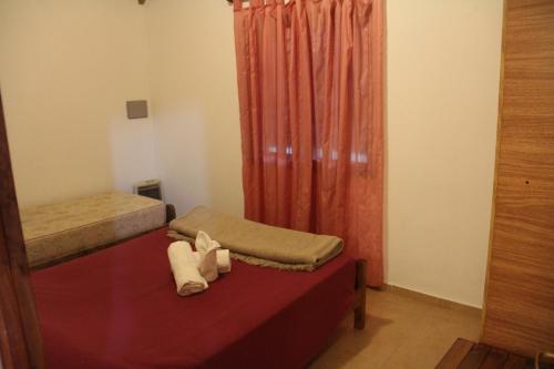 Katil atau katil-katil dalam bilik di Cabaña La Palloza