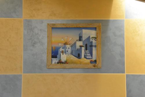 a picture of a painting on a wall at Vecchio Mulino Guest House in Aosta