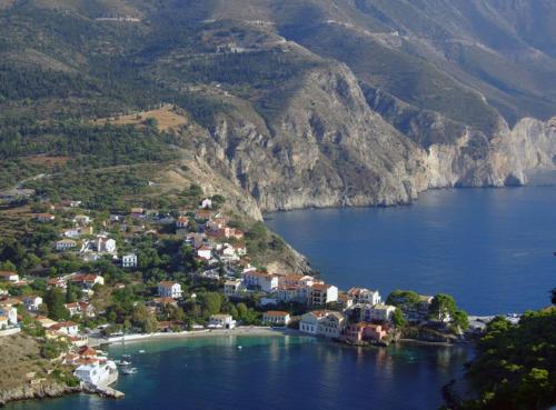 a small town on a hill in a body of water at Evangelia in Ayia Evfimia