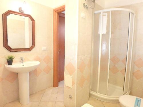 a bathroom with a shower and a sink at Appartamento Perla in Lido di Pomposa