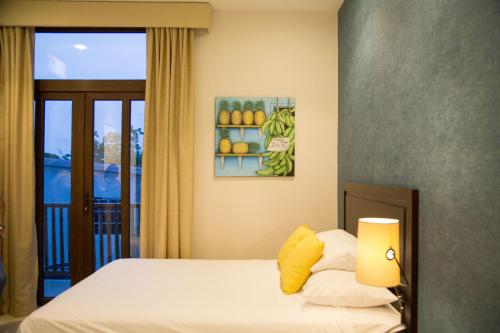 Una cama o camas en una habitación de Hotel Presidente Las Tablas