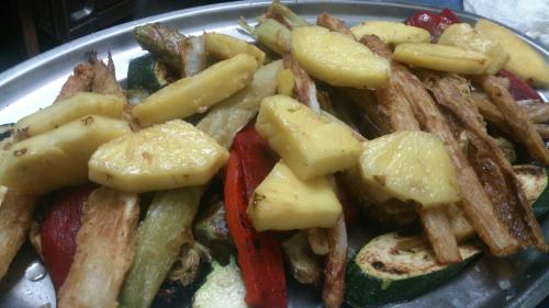 a plate of food with french fries and vegetables at Hotel Rural Grado del Pico in Grado del Pico
