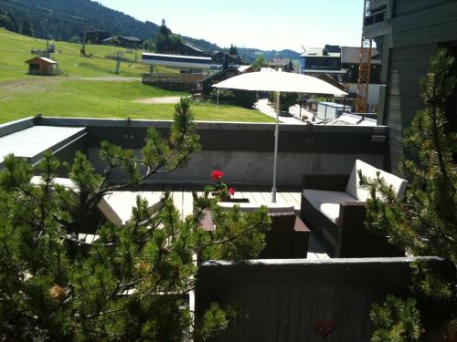a view of a patio with an umbrella at Bellevue in Les Gets