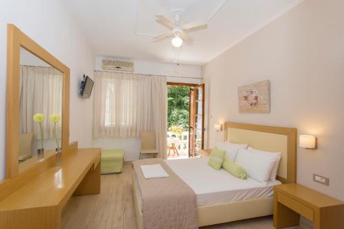 Ένα ή περισσότερα κρεβάτια σε δωμάτιο στο AKANTHUS STUDIOS - Ex Vergos Pavlos