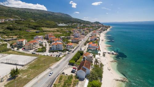 an aerial view of a town next to the ocean at Apartments Leon in Podstrana