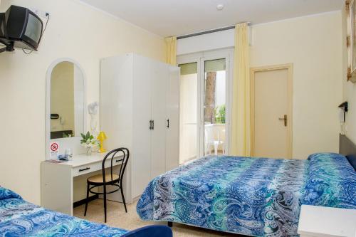 Ένα ή περισσότερα κρεβάτια σε δωμάτιο στο Hotel Cristina Hospitality Centrale