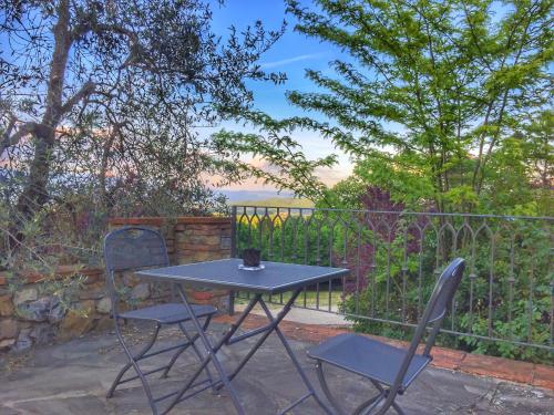 a table and two chairs on a patio at Tenuta Lupinari in Bucine