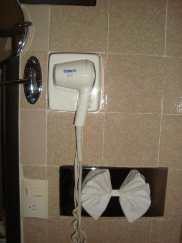 a hair dryer is attached to a wall at Hotel Vista Hermosa in Cuernavaca