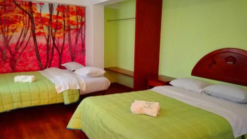 Postel nebo postele na pokoji v ubytování La Posada del Rey - Lima Airport Hostel