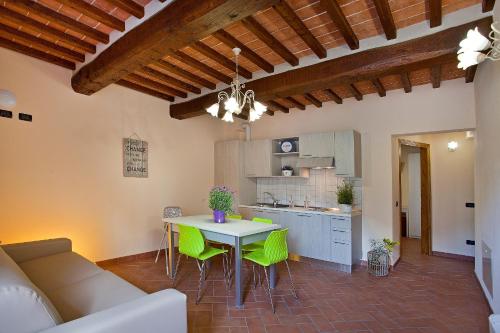 a kitchen and living room with a table and chairs at Tenuta San Giovanni Lucca in Lucca