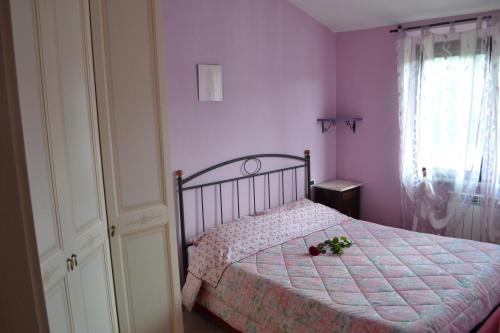 Кровать или кровати в номере Appartamento panoramico