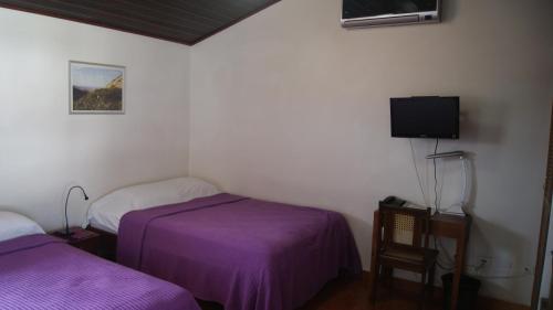 Tempat tidur dalam kamar di Hotel Cacique Adiact