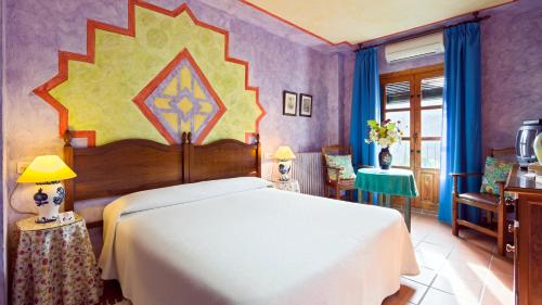 Postel nebo postele na pokoji v ubytování Hotel De Mecina Fondales